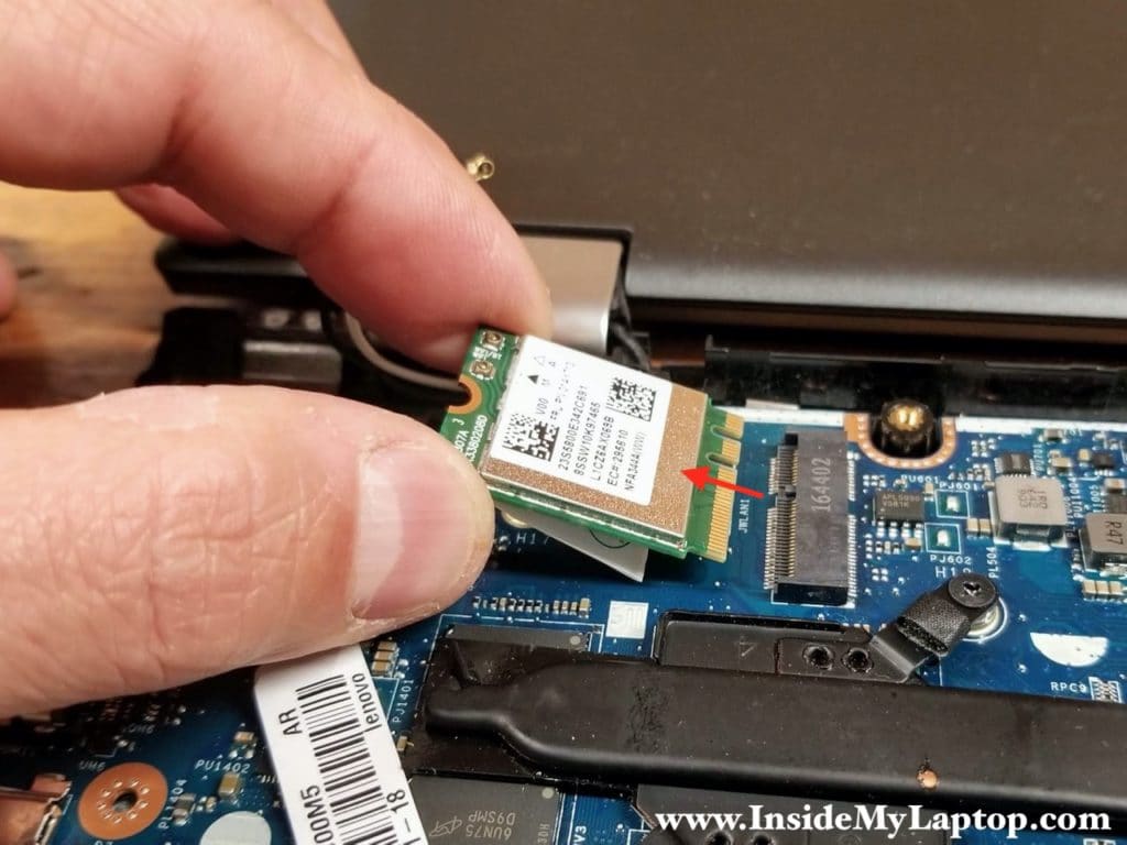 Remove one screw securing the wireless card and pull it out.