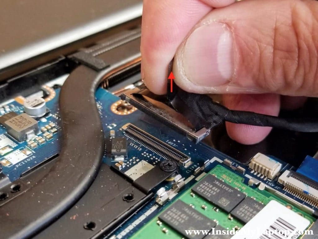 Pull the display cable up to unplug it from the motherboard.