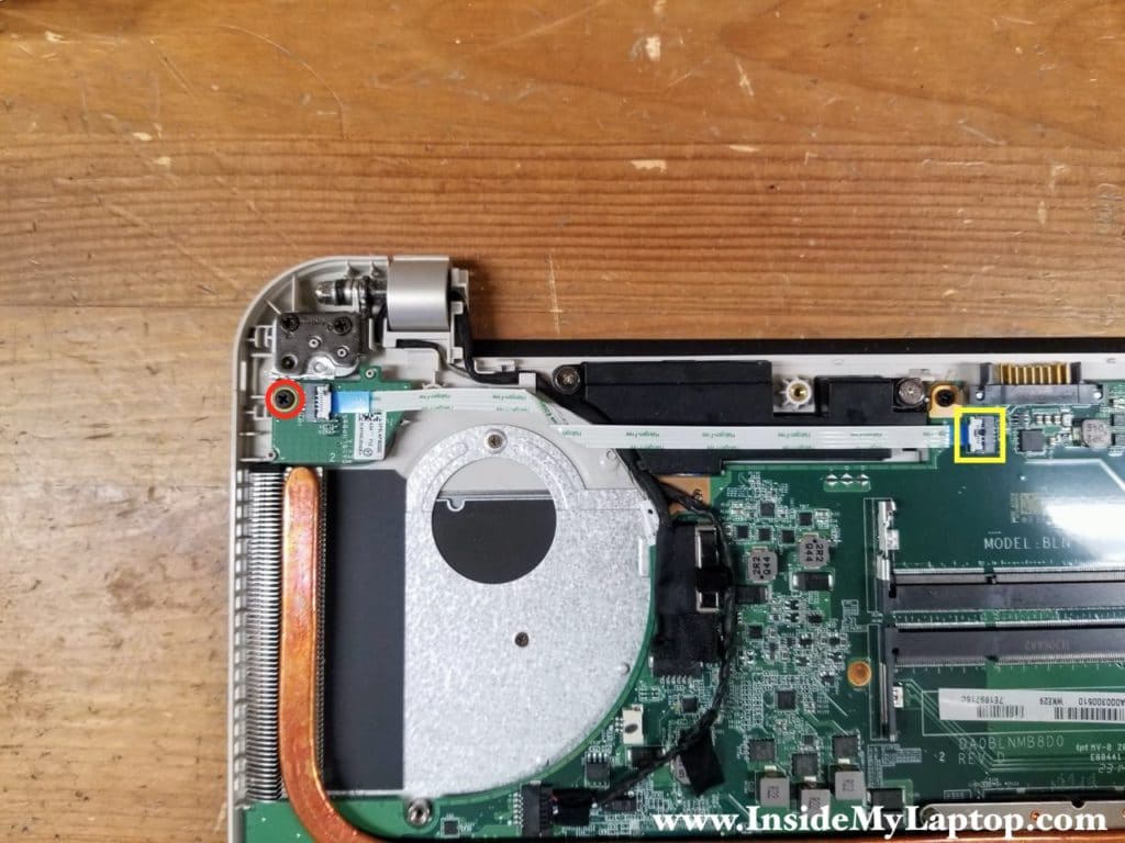 Remove one screw from the power button board and disconnect the cable from the motherboard.