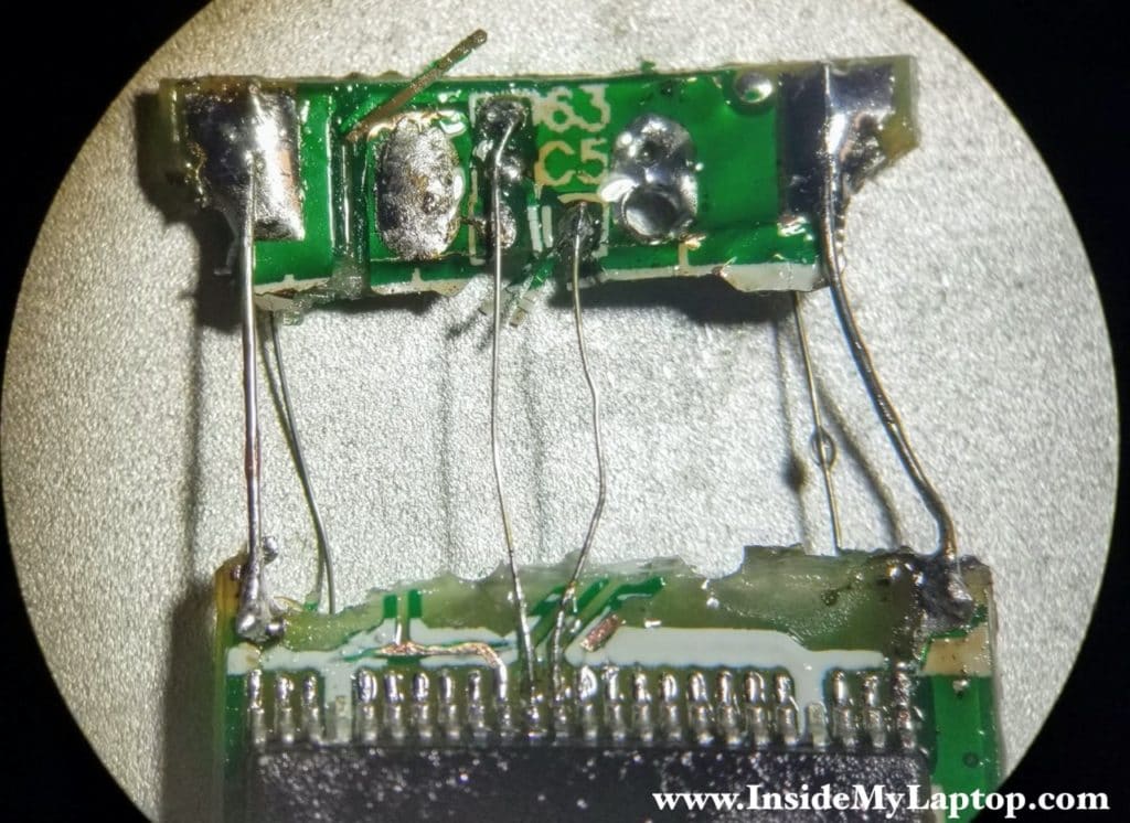 Connecting traces on the other side of the damaged USB flash drive.