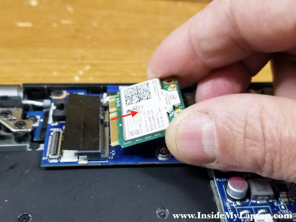 Remove one screw securing the wireless card and pull the card out.