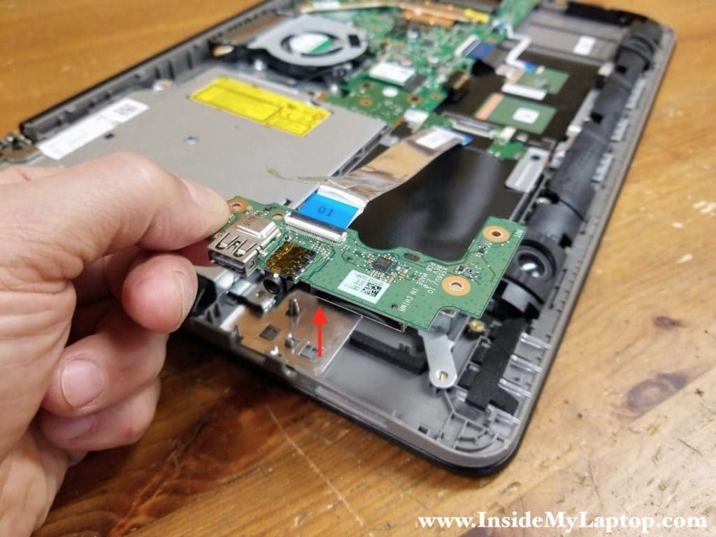 Lift up and remove the I/O board (USB/audio jack/card reader) with the cable attached.