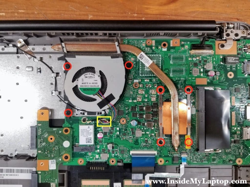 Remove seven screws securing the cooling fan assembly and disconnect the fan cable.