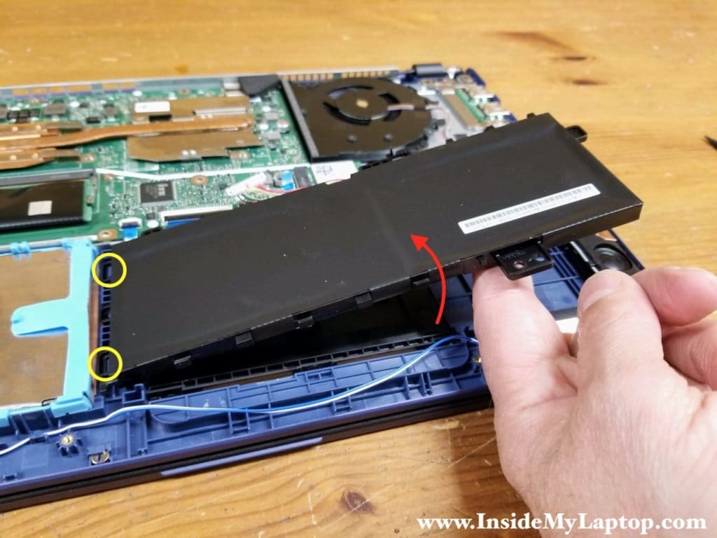 Lift up the battery and remove it from the top case.