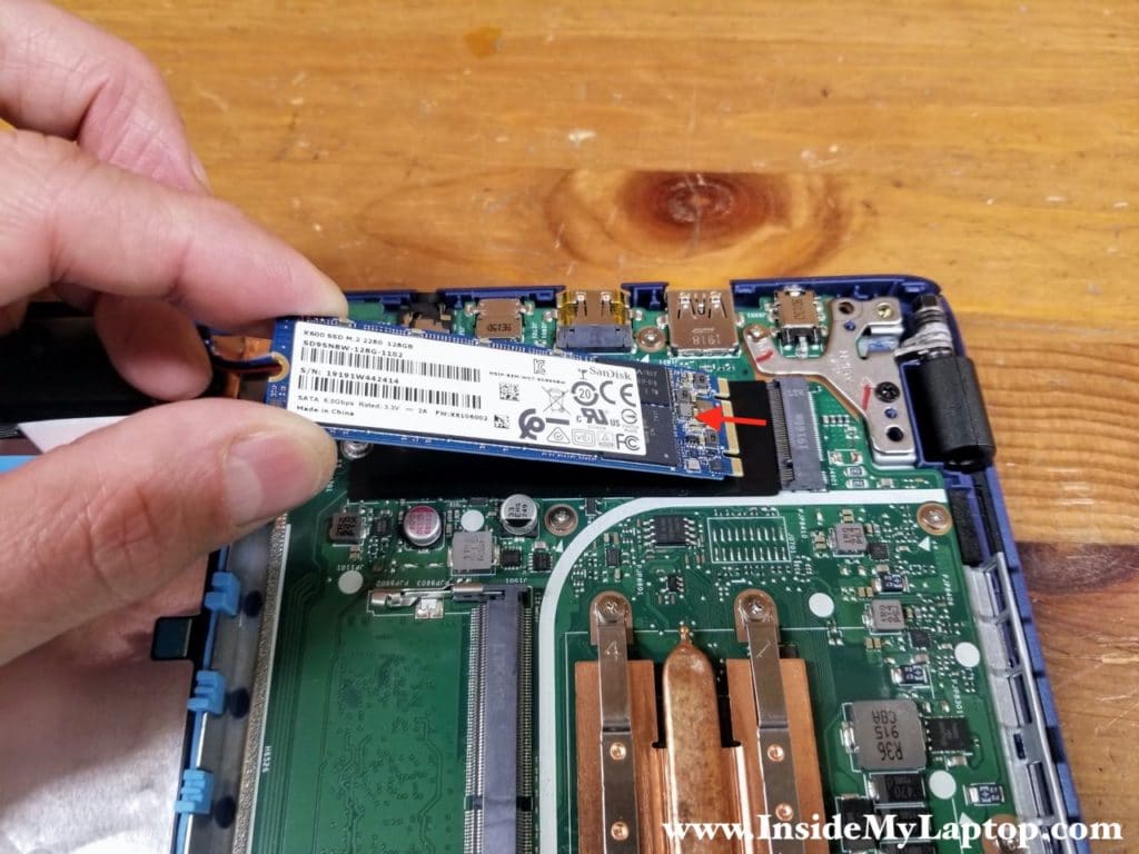 Remove one screw securing the M.2 SATA SSD and pull the SSD out.