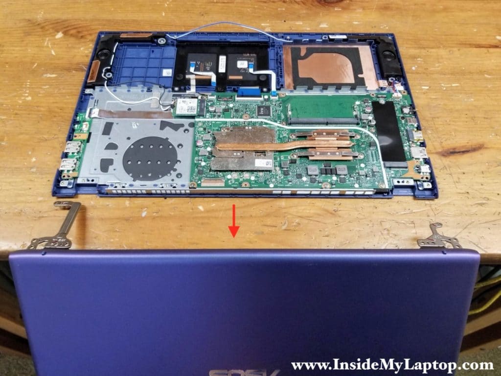 Now you can separate the display panel from the top case assembly and remove it.