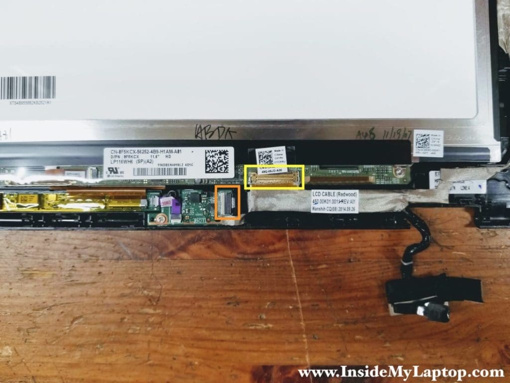 Disconnect the Windows-button board cable and the display cable.