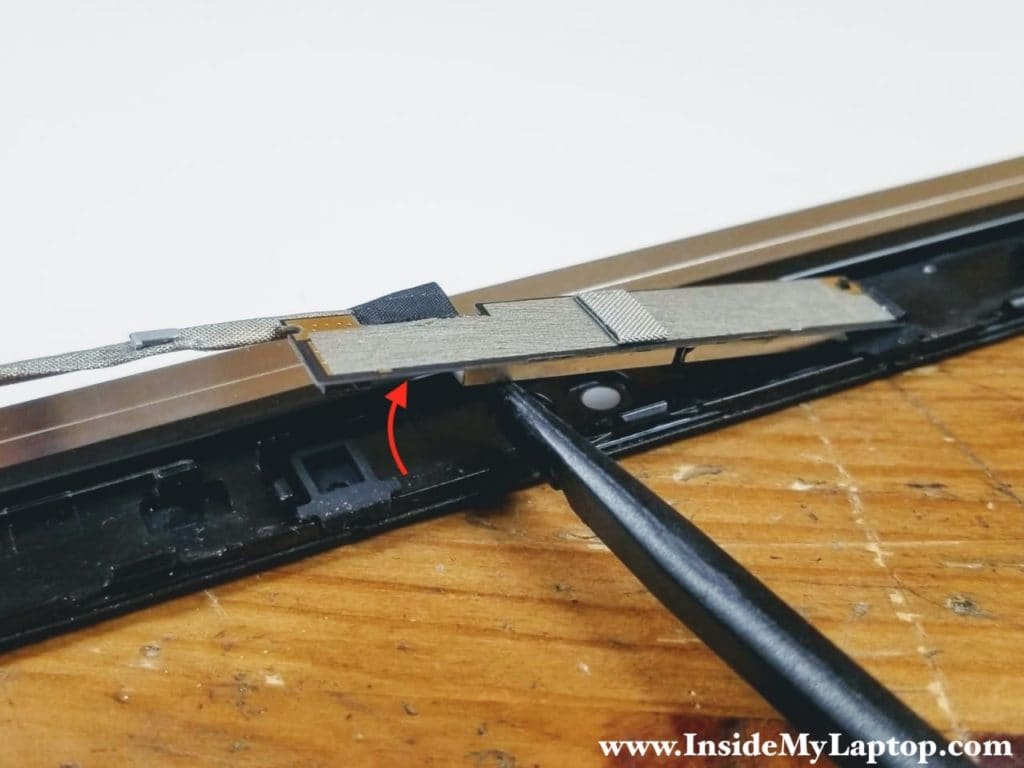 Pry up and remove the webcam board.