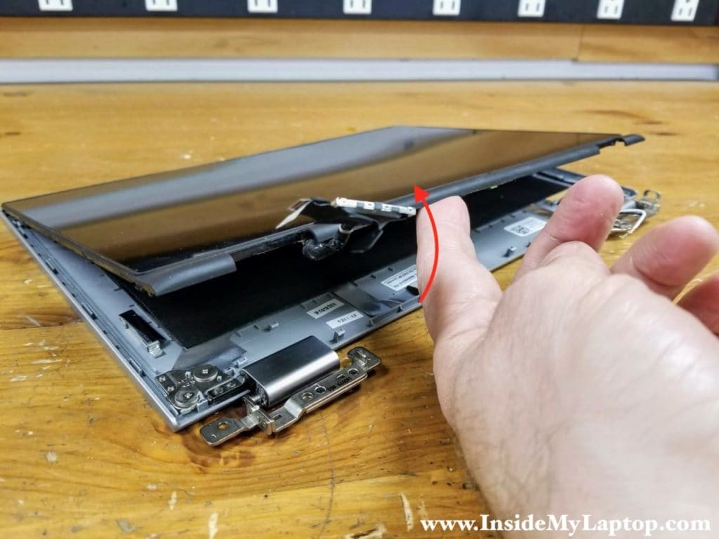 Separate the bottom side of the touchscreen assembly from the display back cover.