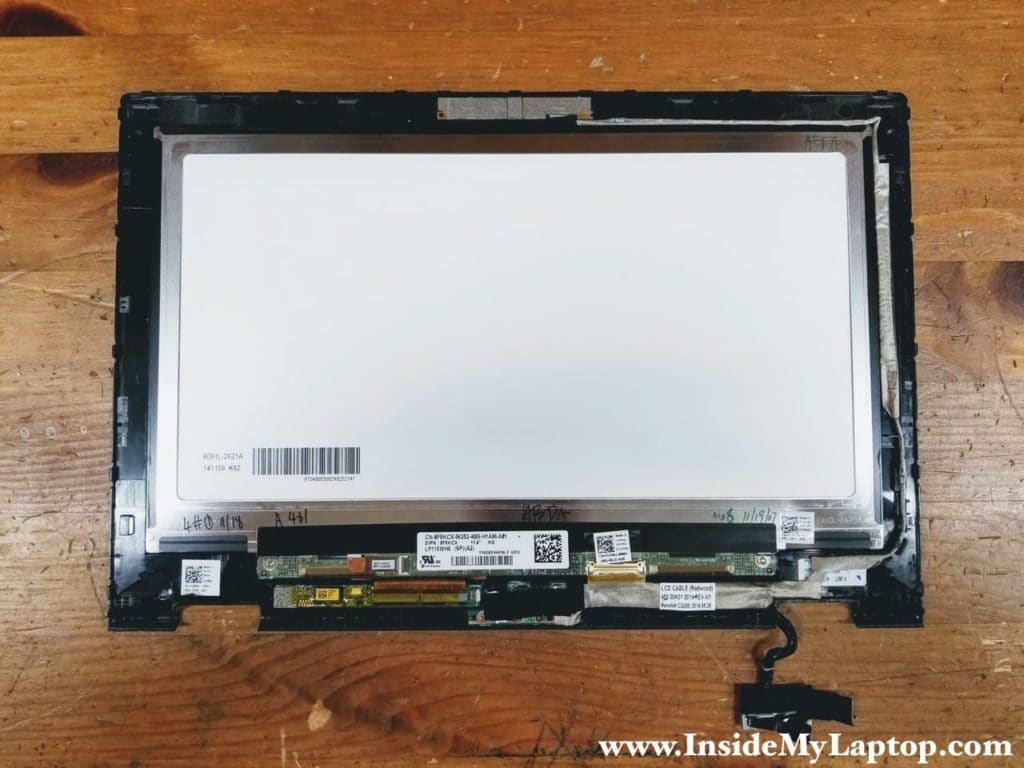 The webcam and display cable harness is routed on the right side of the display panel.