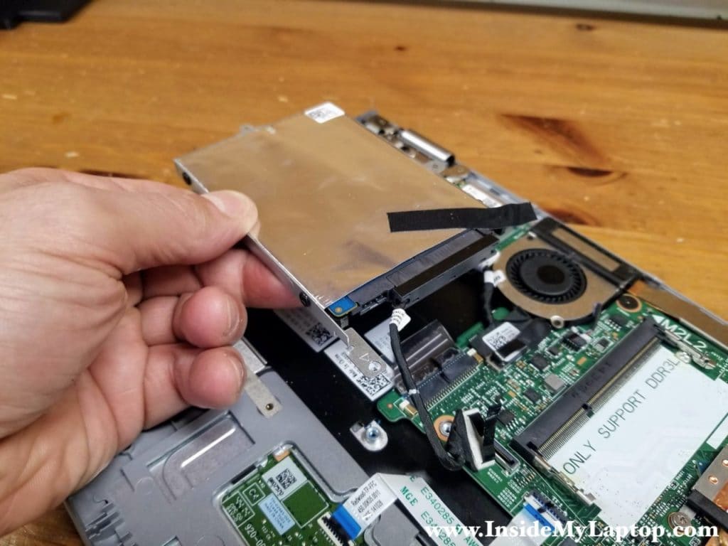 Remove the hard drive assembly with the cable attached to it.