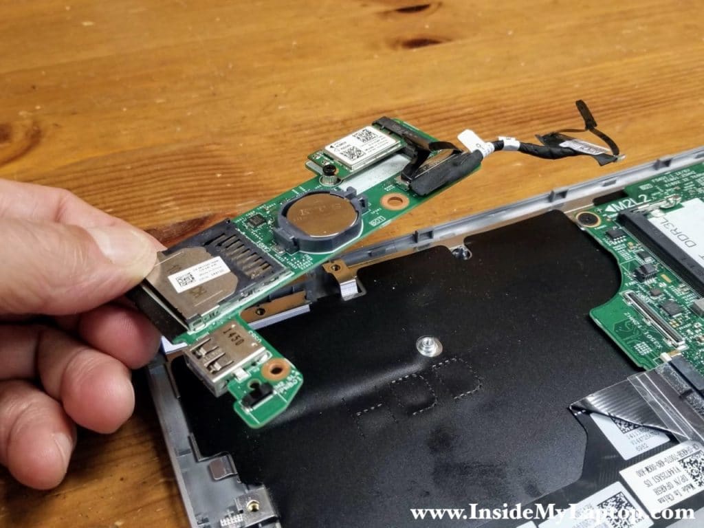 Lift up and remove the USB/media reader board.