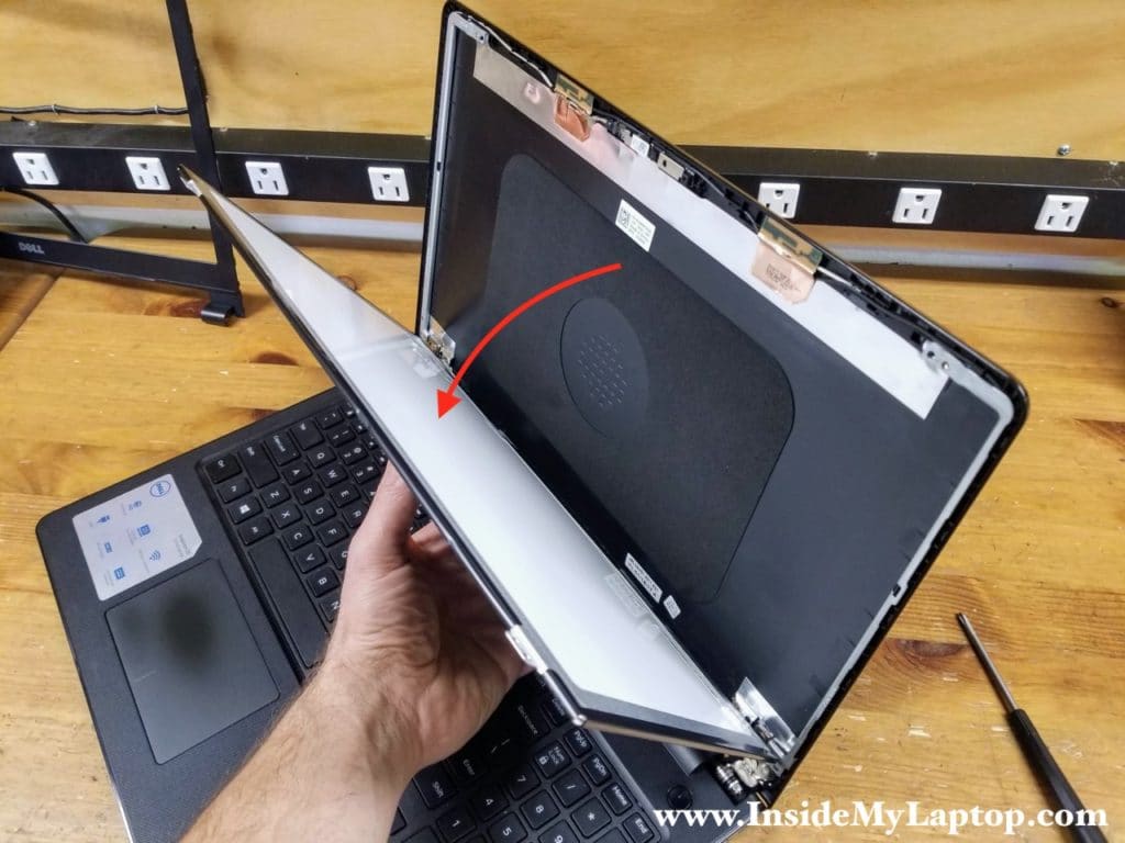 Carefully separate the LCD screen from the display back cover and place it the front side down on the keyboard.