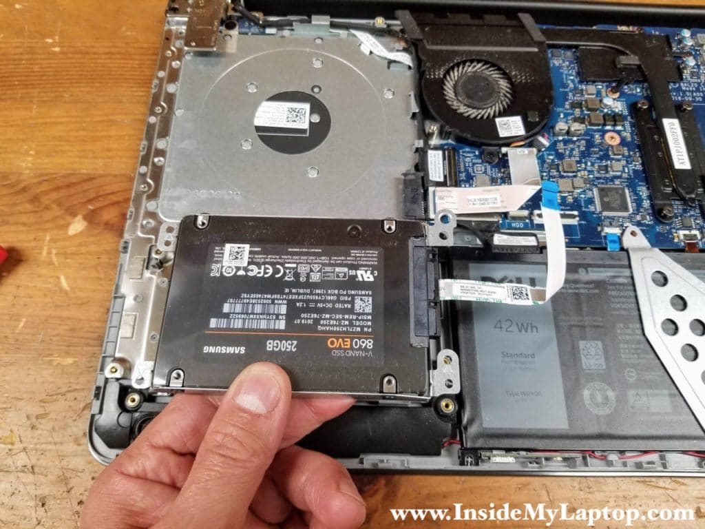 Lift up and remove the hard drive assembly with the SATA cable attached.