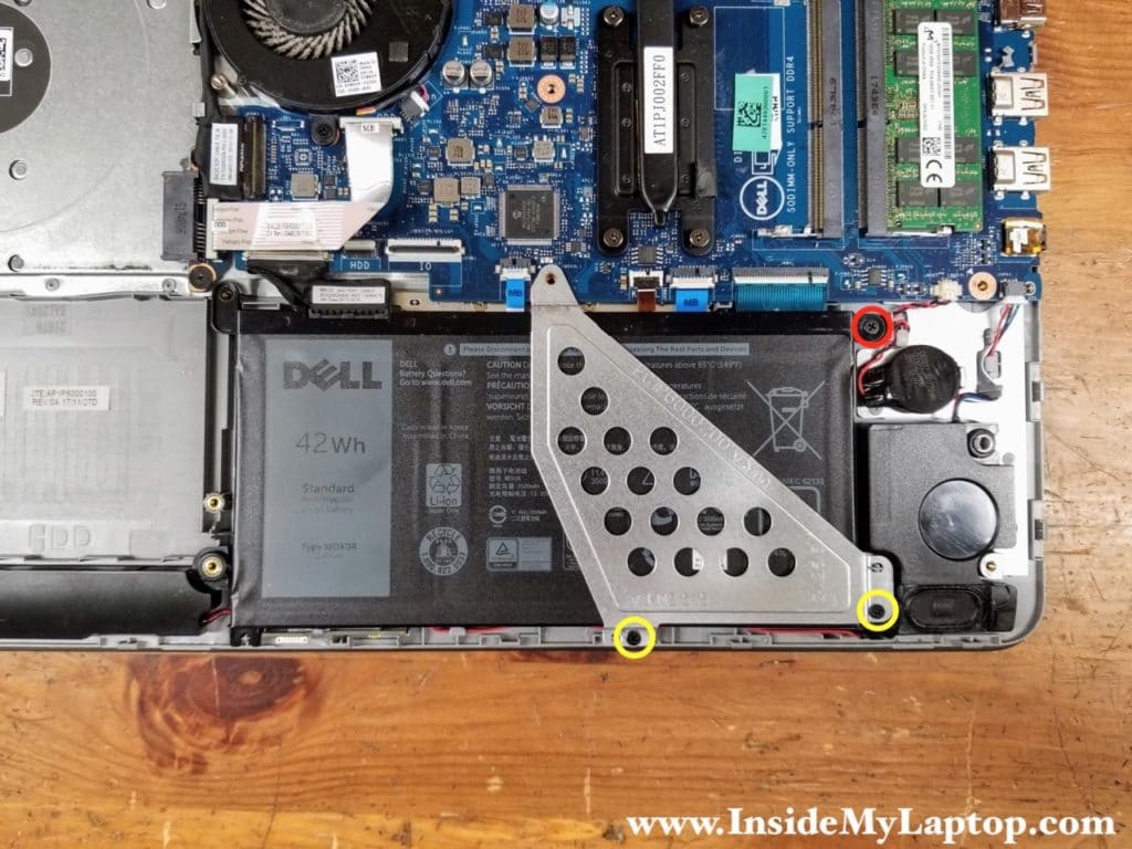 Remove one screw (red) securing the battery and two screws (yellow) securing the battery bracket. Remove the bracket.