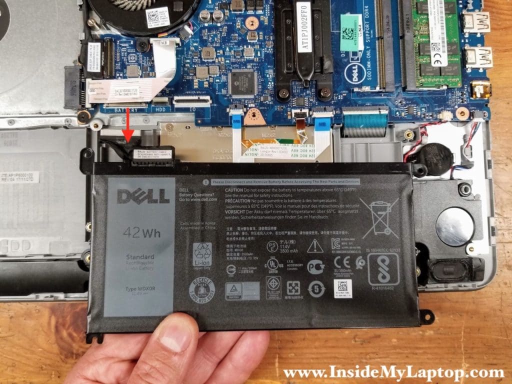 Lift up the battery and disconnect it from the motherboard.