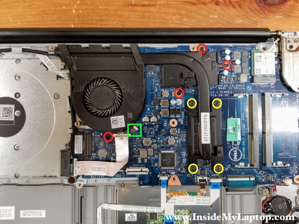 Remove four screws (red) and loosen four captive screws (yellow) attaching the cooling fan/heatsink assembly to the motherboard. Disconnect the fan cable.