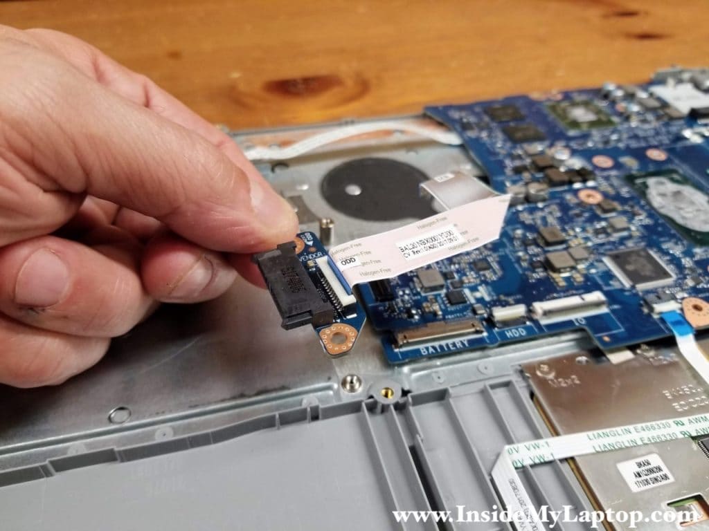 Remove the optical drive connector board with the cable attached.
