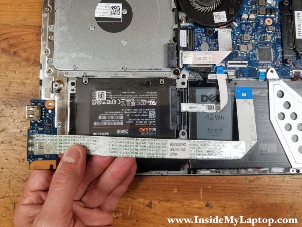 Lift up and remove the I/O board with the cable attached.
