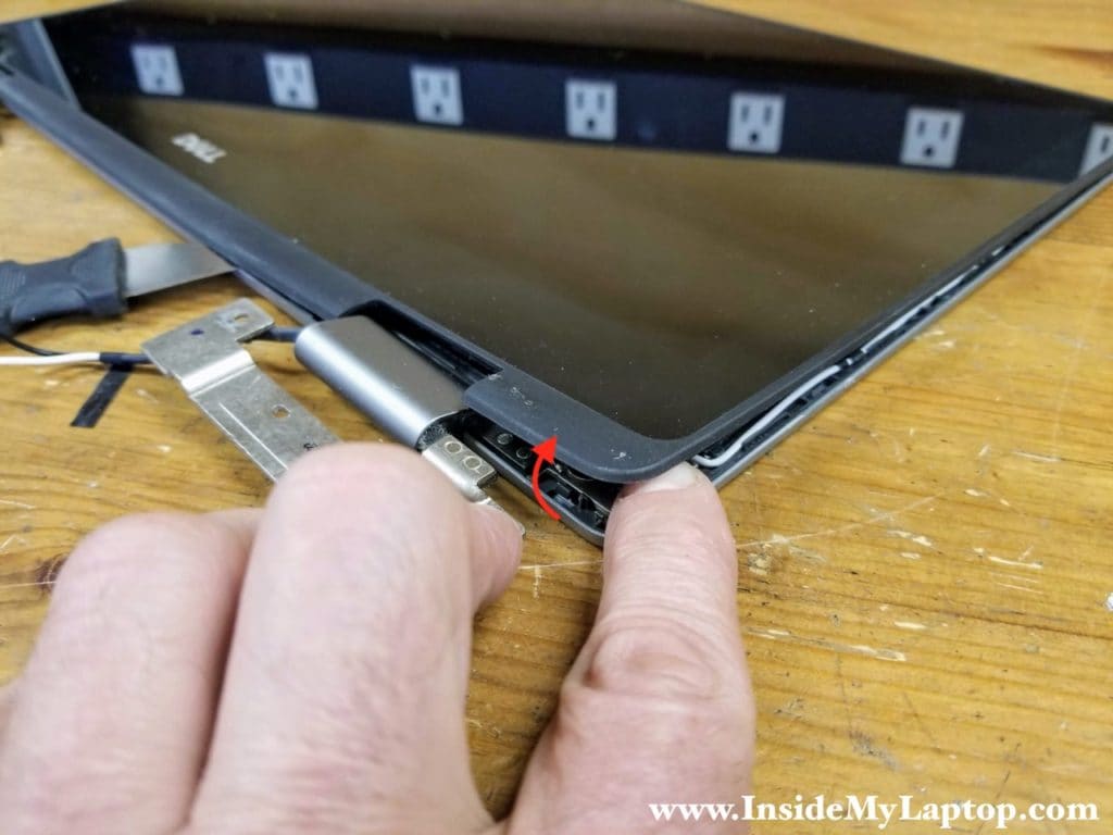 Separate the touchscreen from the display back cover around hinge area.