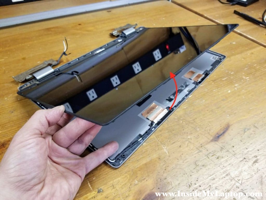 Continue removing the touchscreen.