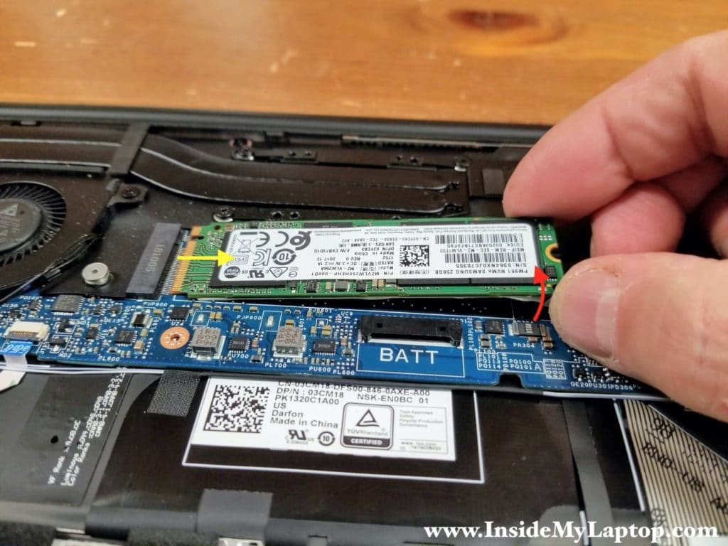 Lift up the right side of the SSD and pull it out of the slot.