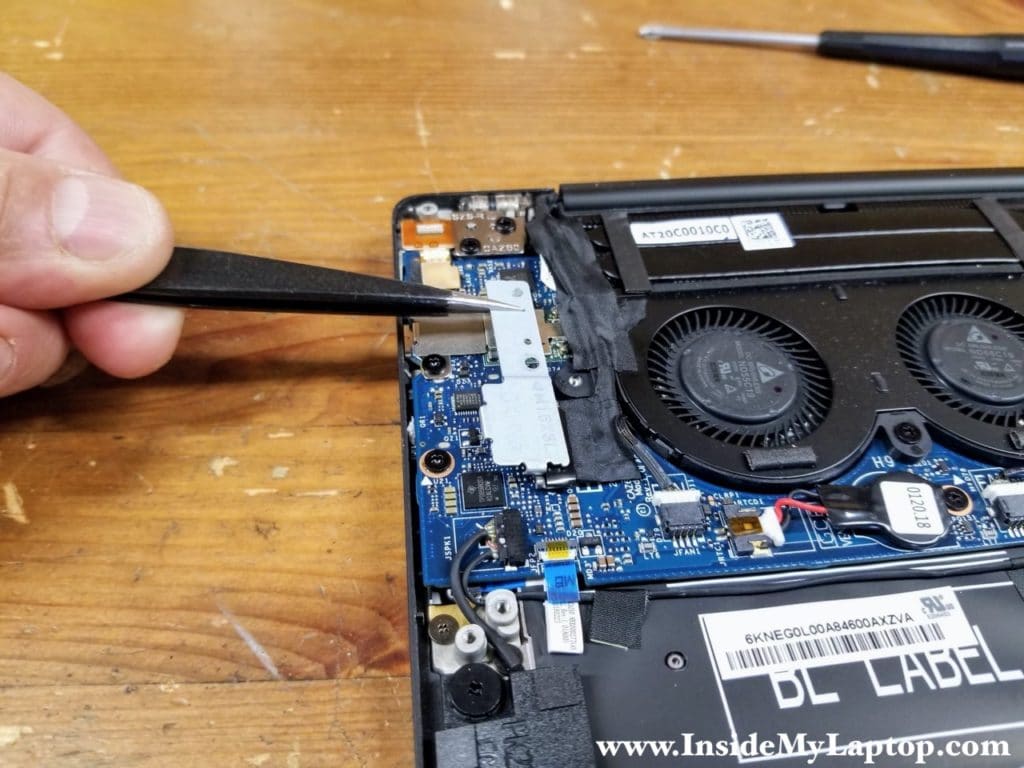 Remove the webcam and wireless antenna cover.