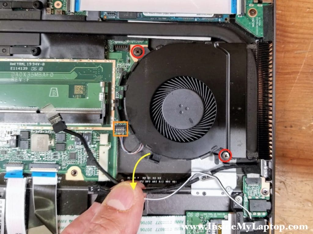 Remove two screws and disconnect the fan cable from the motherboard.