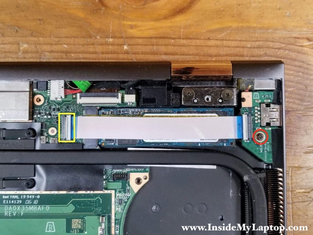 Remove one screw securing the USB power button board and disconnect the I/O cable from the motherboard.