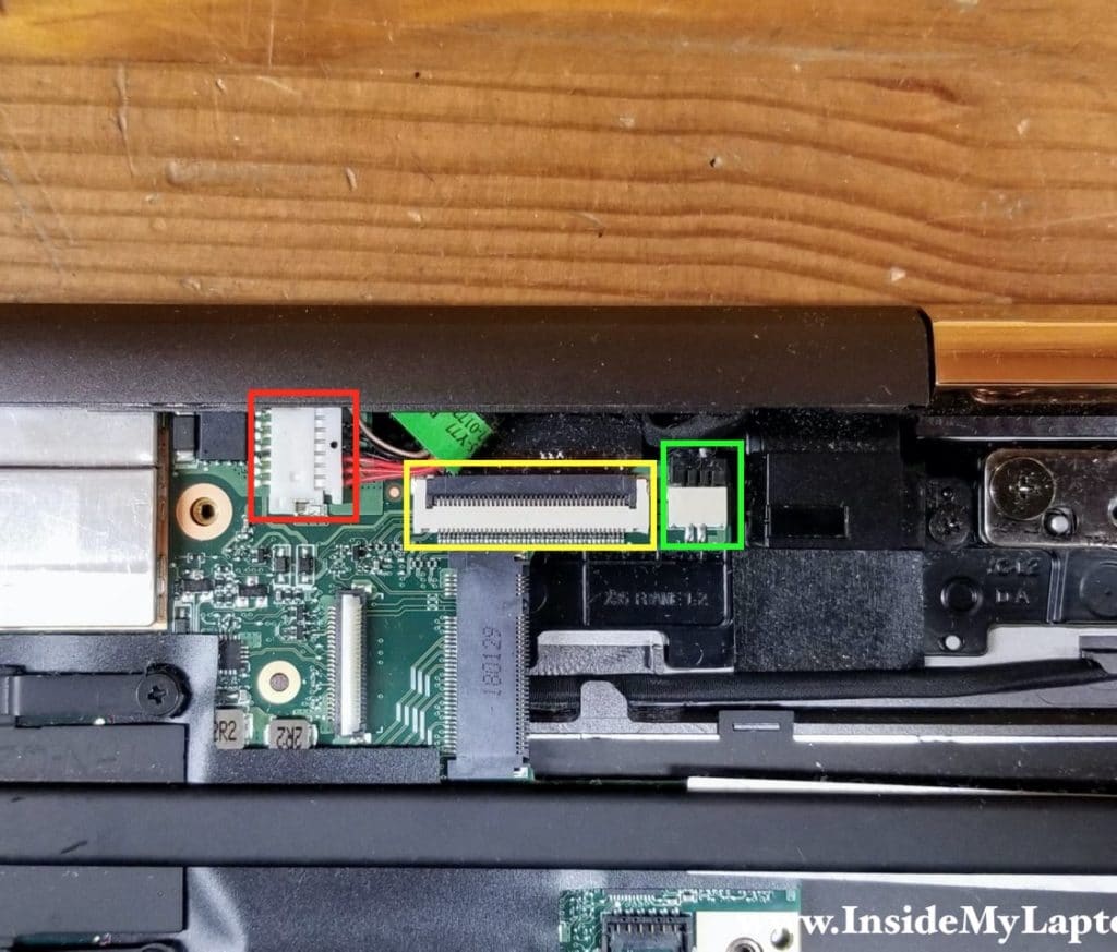 Disconnect the DC power jack cable, the display panel cable and the right rear speaker cable from the motherboard.