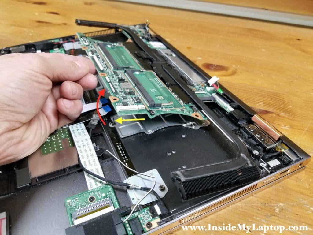 Separate the motherboard from the top case assembly.