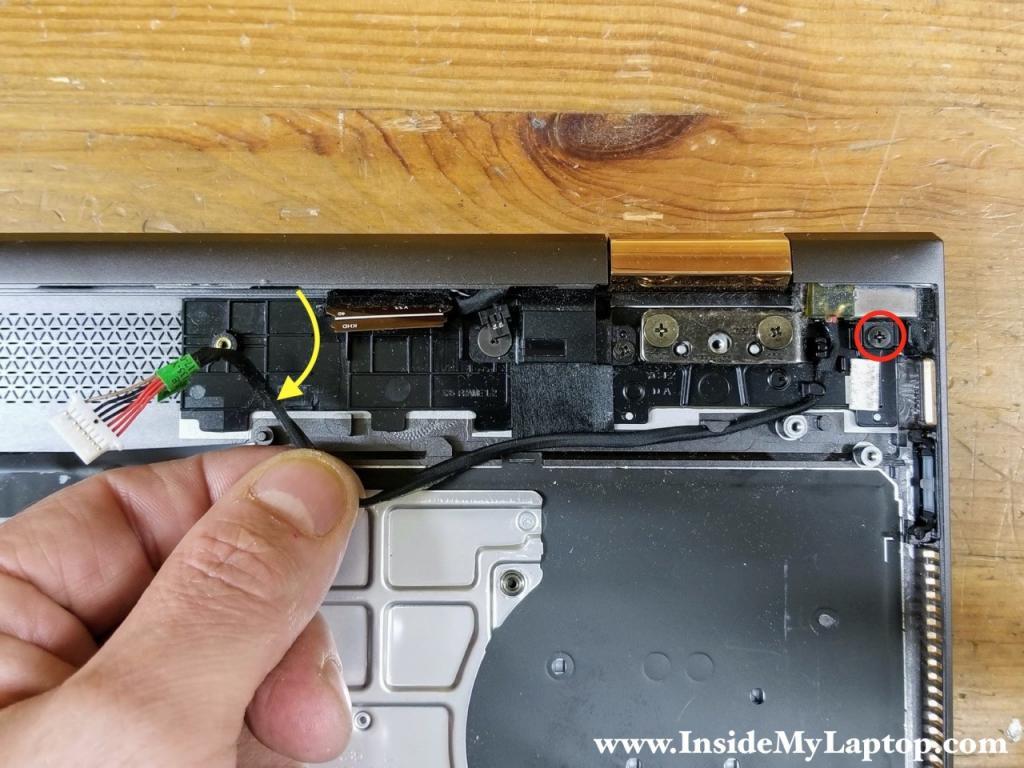 Remove one screw securing the DC-IN power jack and pull the DC jack cable from the case