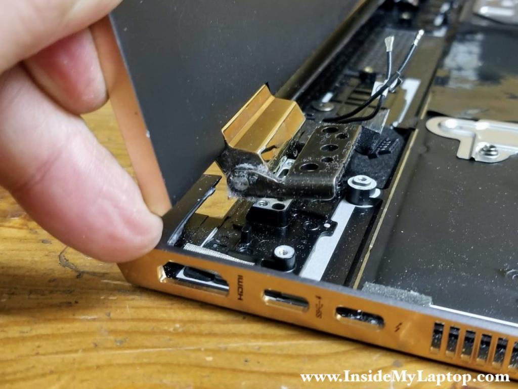 Lift up the display panel assembly and separate it from the top case.