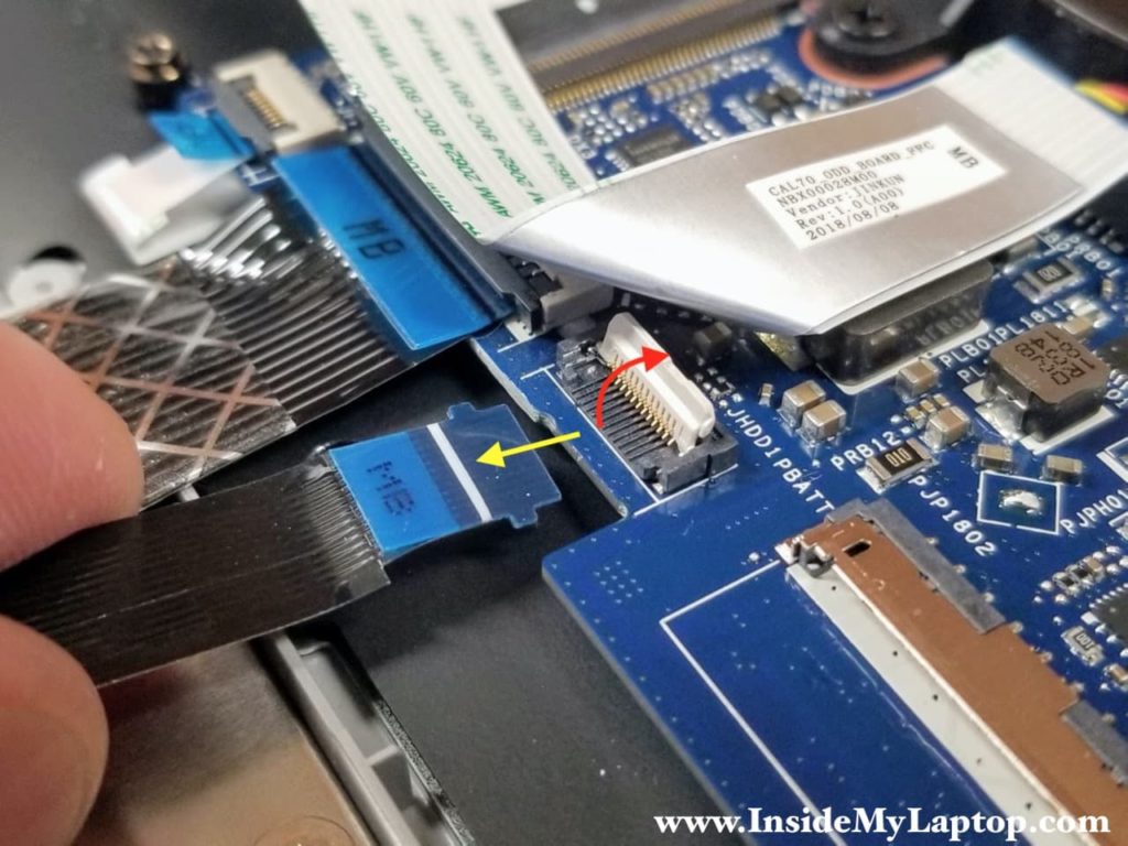 Here's how to disconnect the SATA cable from the motherboard.