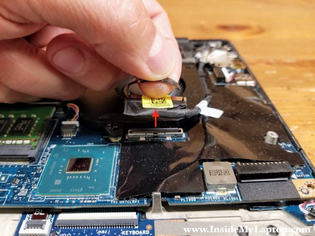 Unplug the display cable from the motherboard.