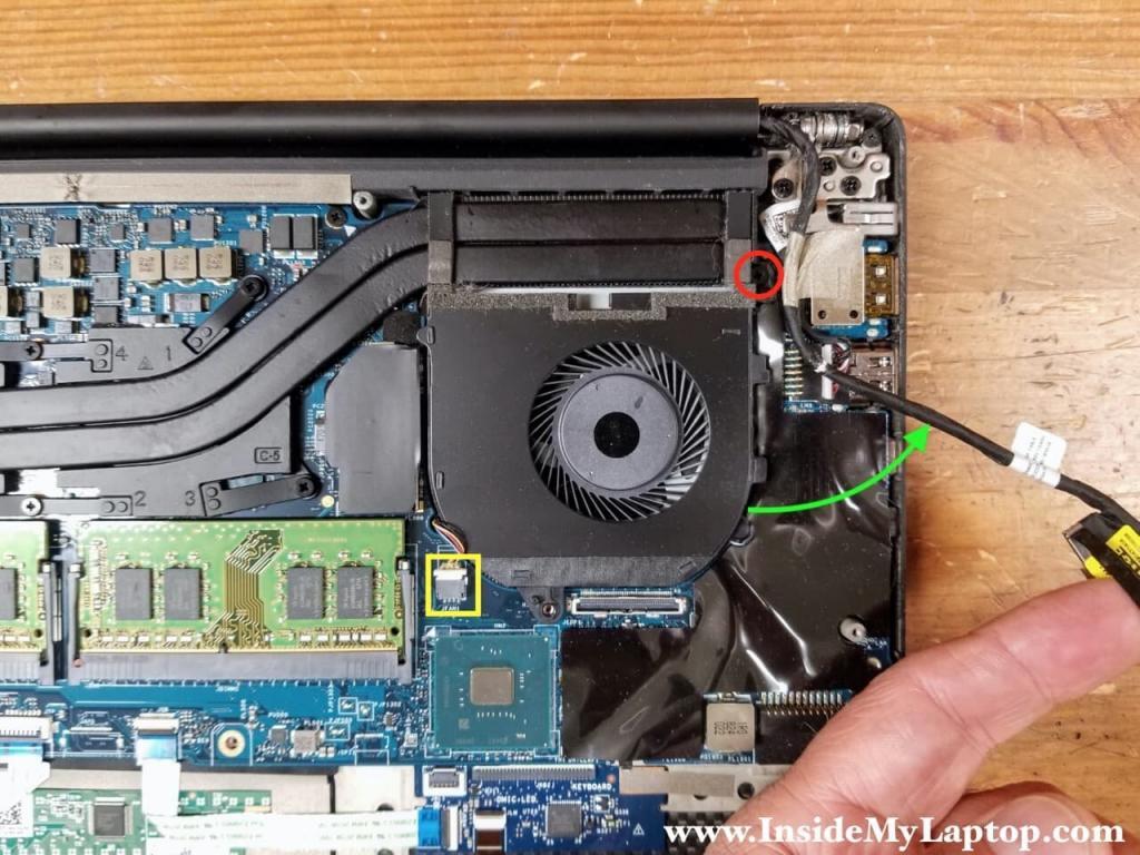 Remove one screw securing the fan and disconnect the cable from the motherboard.