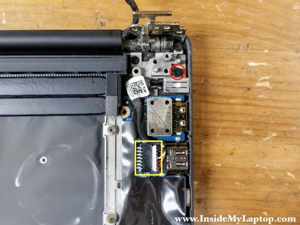 Remove one screw securing the DC power jack and disconnect the DC jack cable from the motherboard.