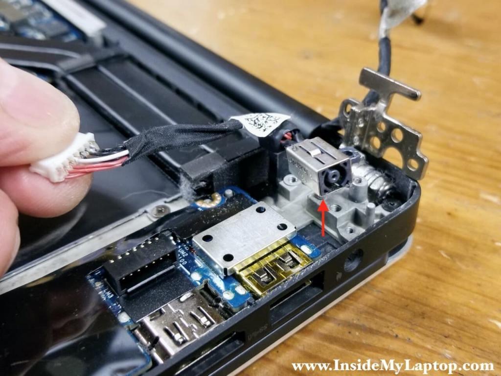 Lift up and remove the DC power jack.