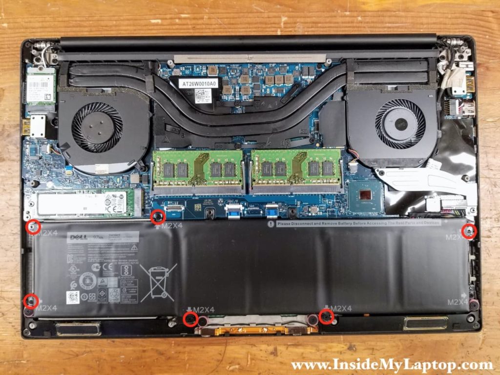 Remove six screws attaching the battery to the top case.