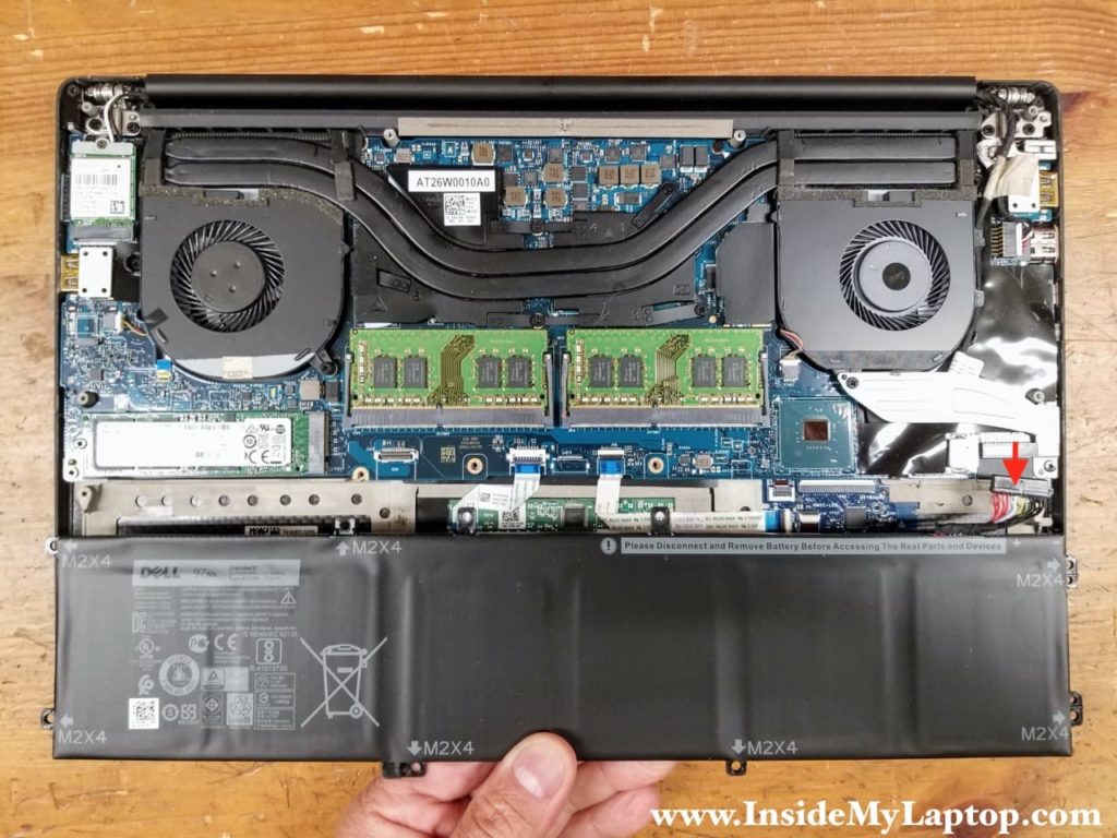 Lift up the battery and disconnect the battery cable from the motherboard. Remove the battery.