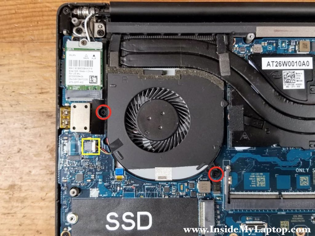 Remove two screws securing the right cooling fan. Disconnect the fan cable from the motherboard.