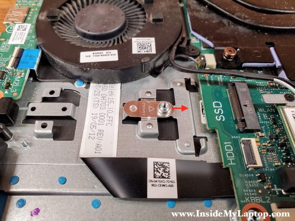 Slide the SSD mounting bracket to the right to separate it from the top case.