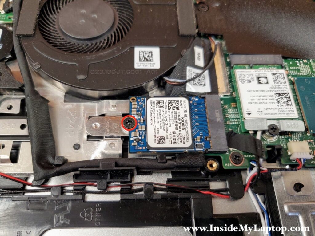 Remove one screw securing the SSD.