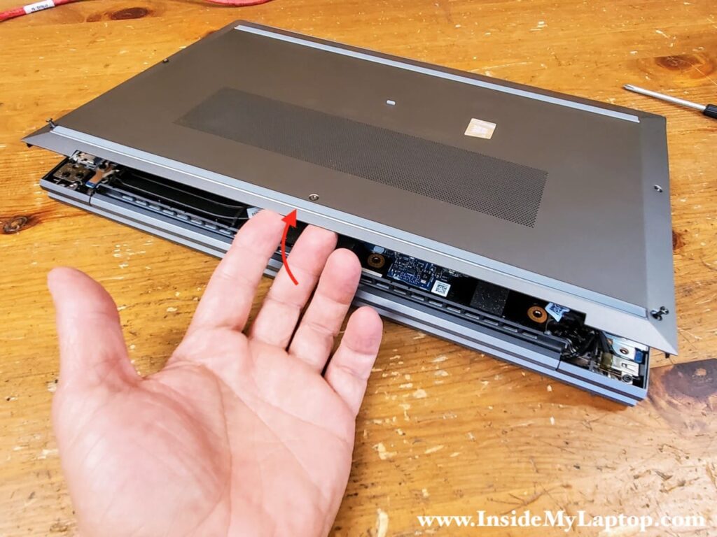 Start removing the bottom cover on the back side of the laptop. 