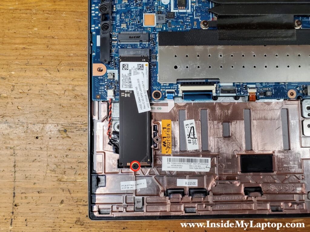 Remove one screw securing the SSD.