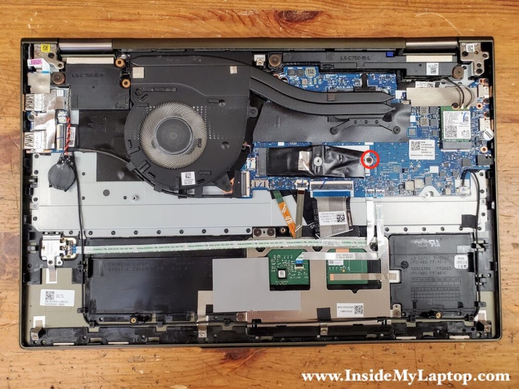 Remove one screw holding the solid state drive (SSD) in place.