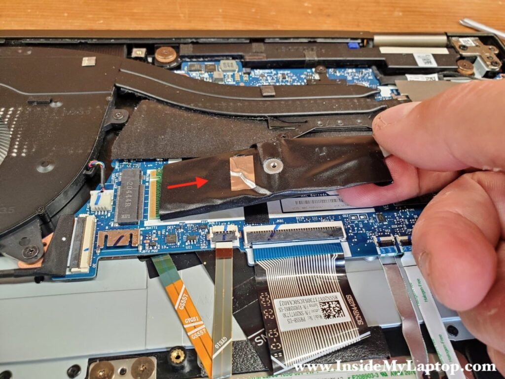 Pull the SSD out of the slot to remove it.