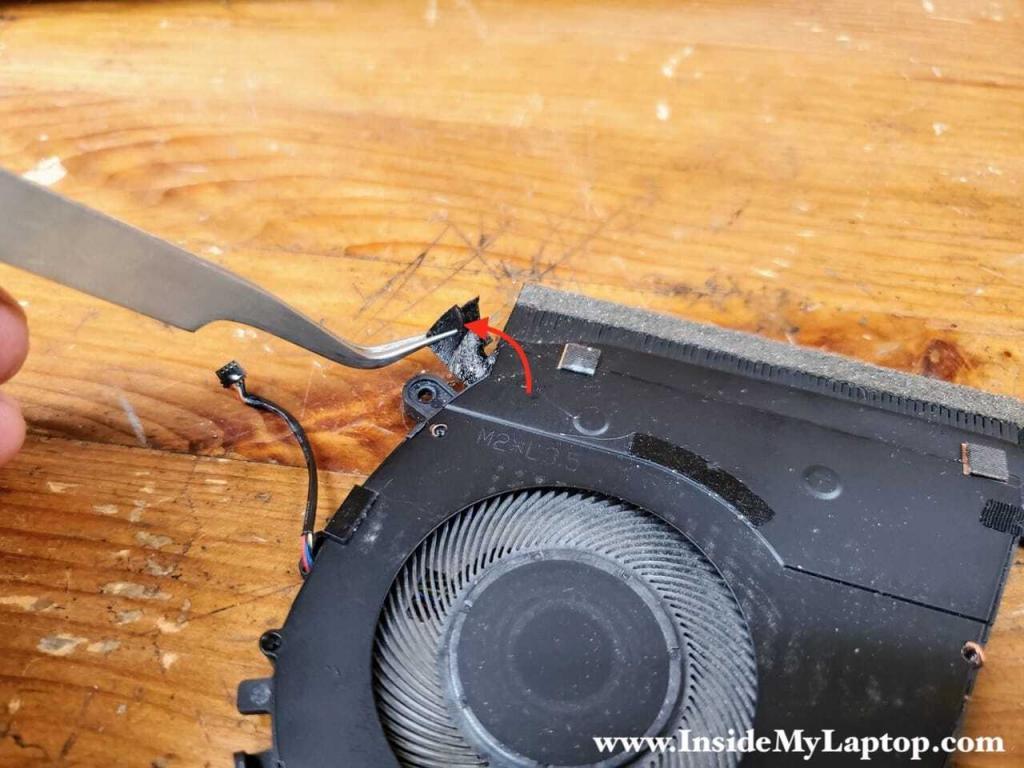 Start removing black tape covering the fan.