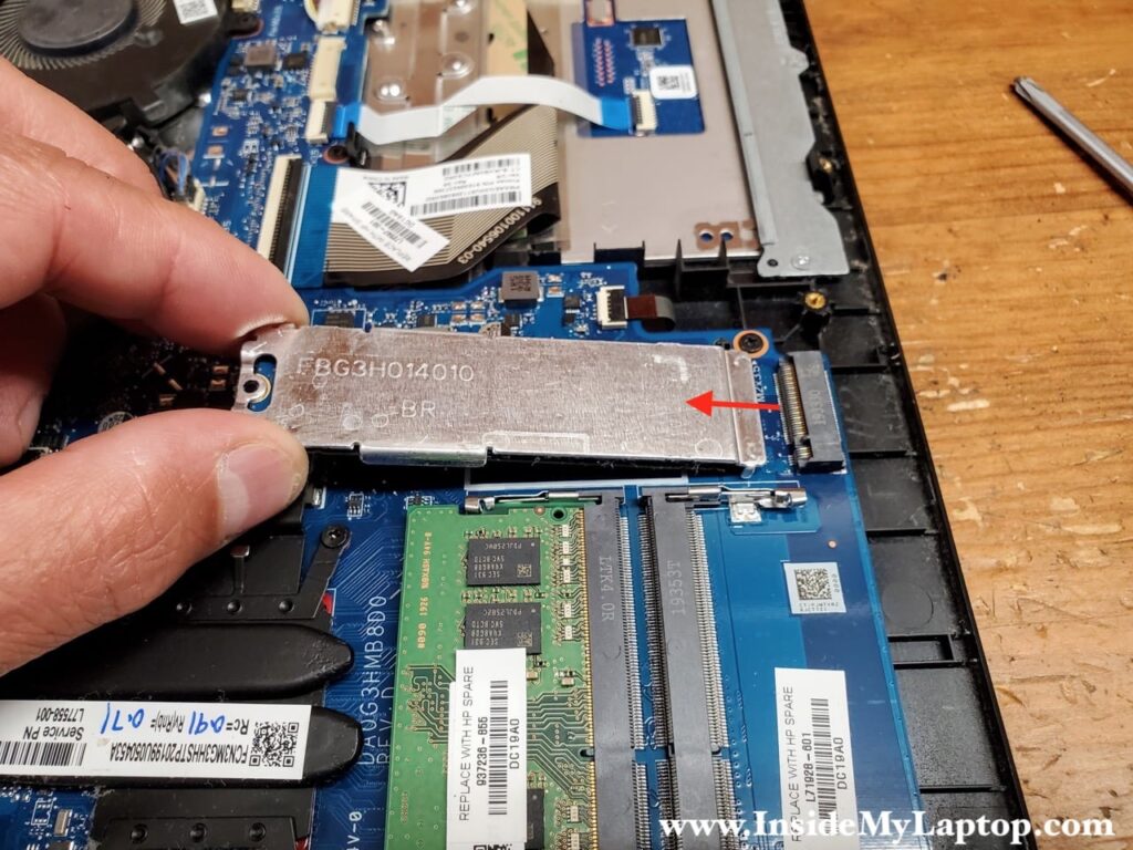 Remove one screw securing the solid state drive (SSD) and the heatsink.