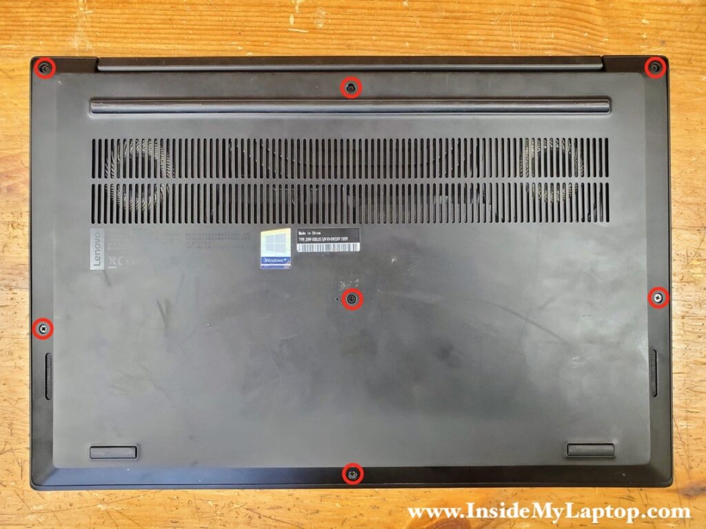 Unscrew seven captive screws holding the bottom cover.
